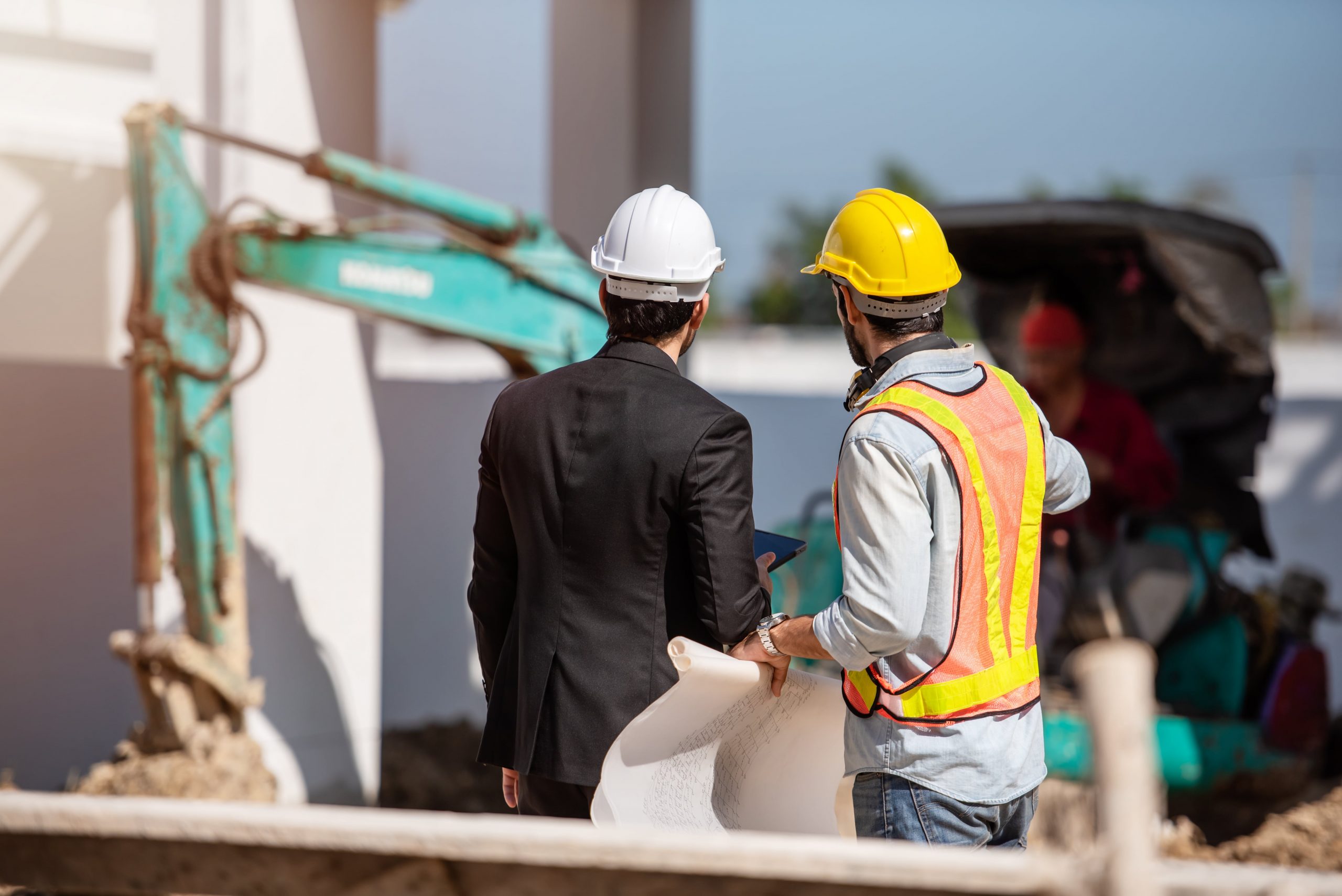 construction-worker-engineer-working-together-construction-site-min-scaled.jpg